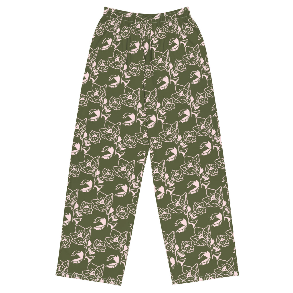 A pair of green wide-leg pants with a floral pattern, featuring side pockets and an elastic waistband with a white drawstring.