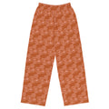 A pair of orange wide-leg pants with a floral pattern, featuring an elastic waistband with a white drawstring and practical side pockets.