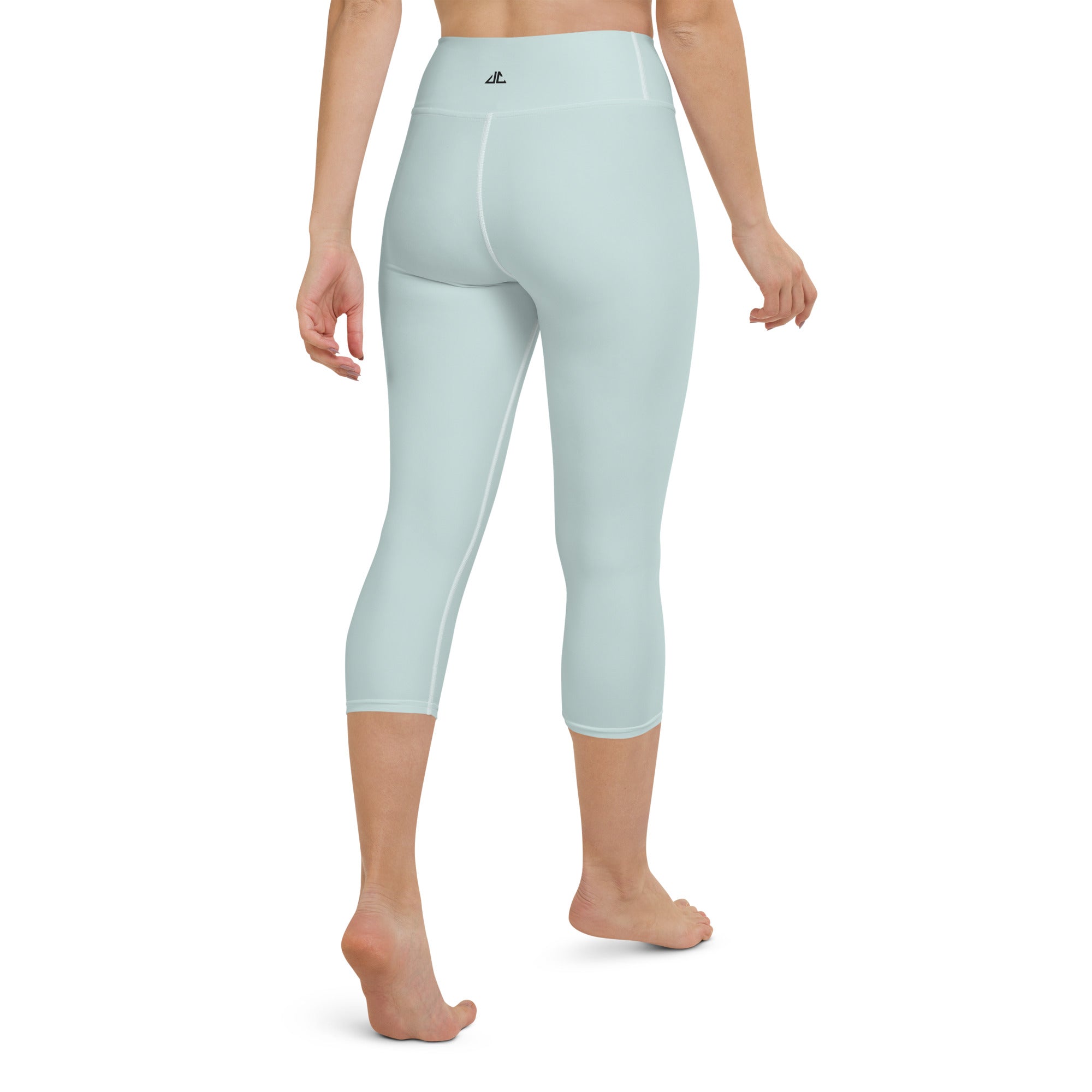 a women model wearing a high waist capri leggings