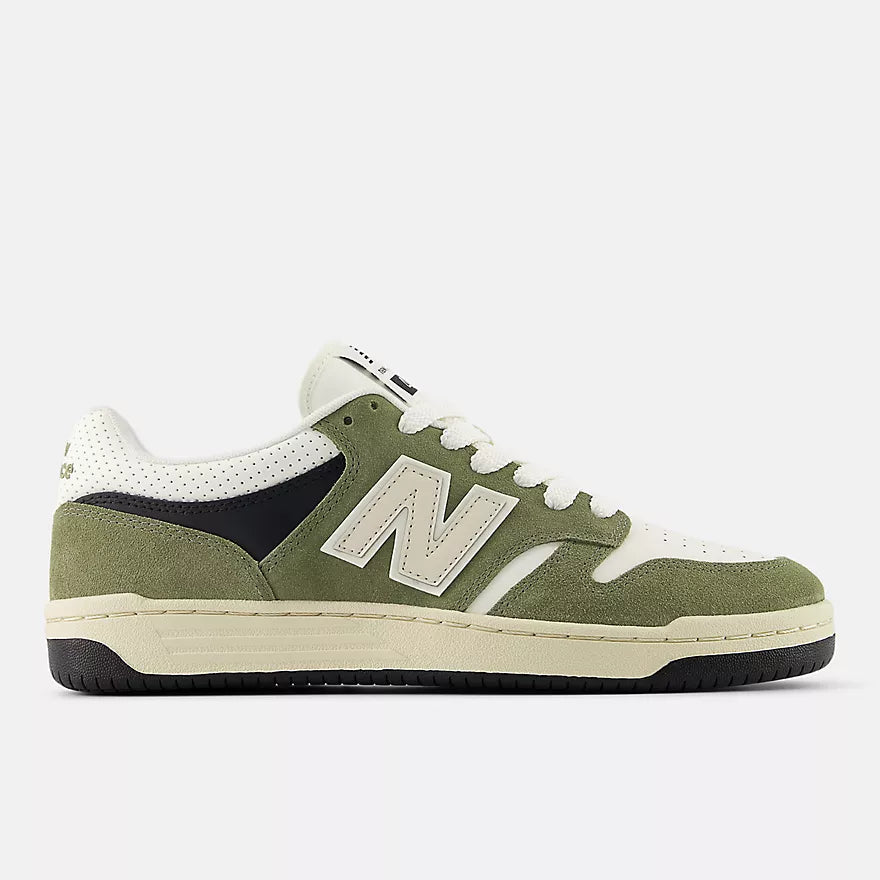 New Balance Green sneaker with white accents on a light gray background
