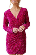 Woman wearing a sparkly pink dress against a plain background