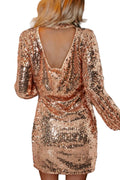 Rose gold sequin dress with a backless design, worn by a person, with a blurred festive background.