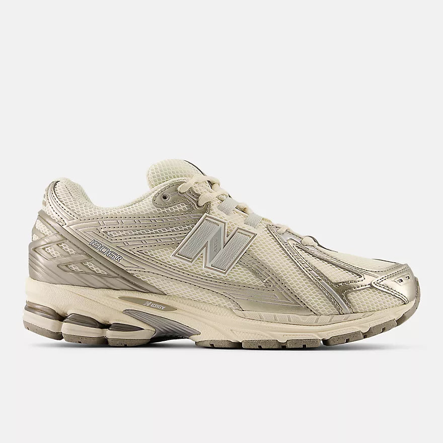New Balance Beige running shoe with New Balance logo on a white background
