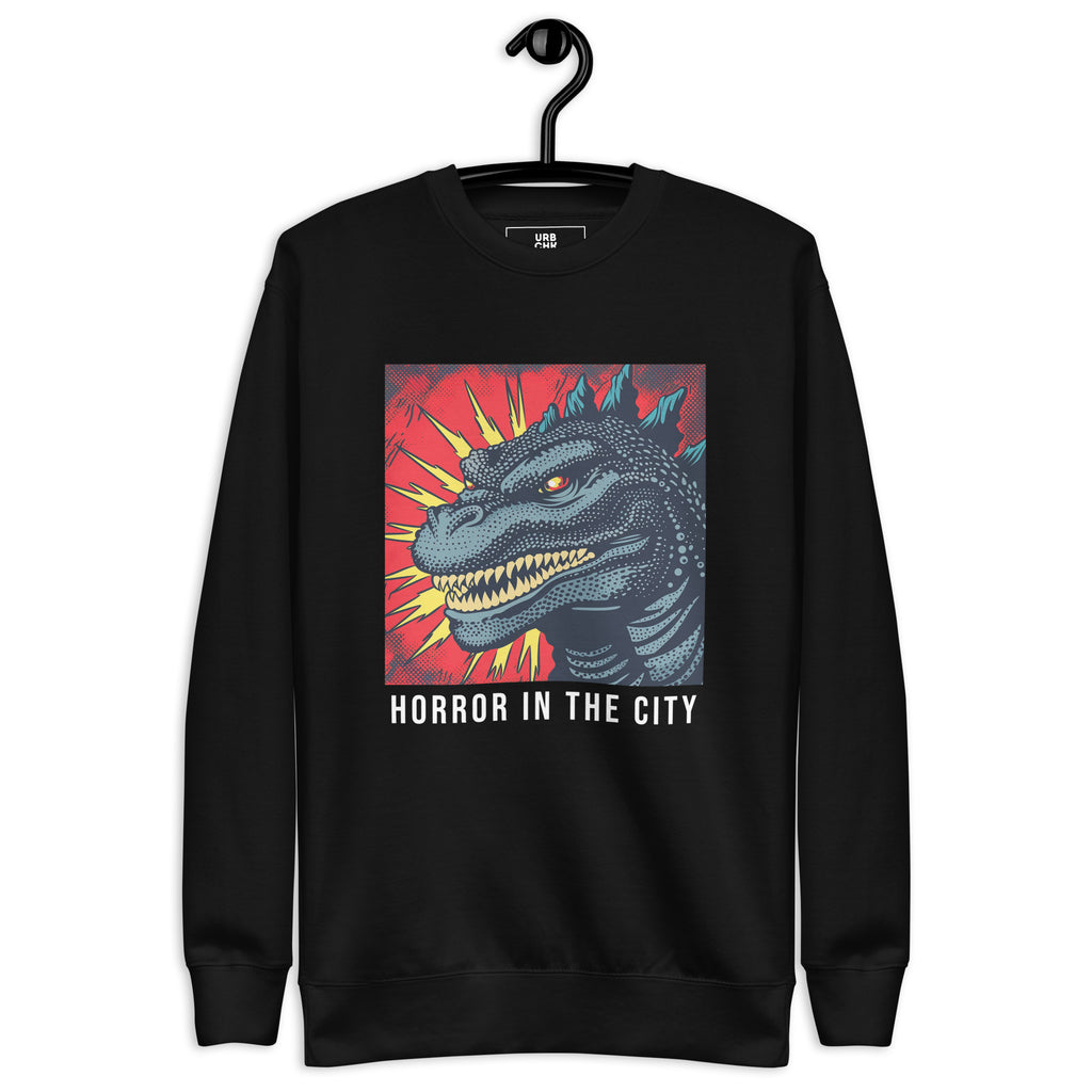 A black crew neck sweatshirt with a graphic print of a monster and the text 'Horror in the City' on the front.