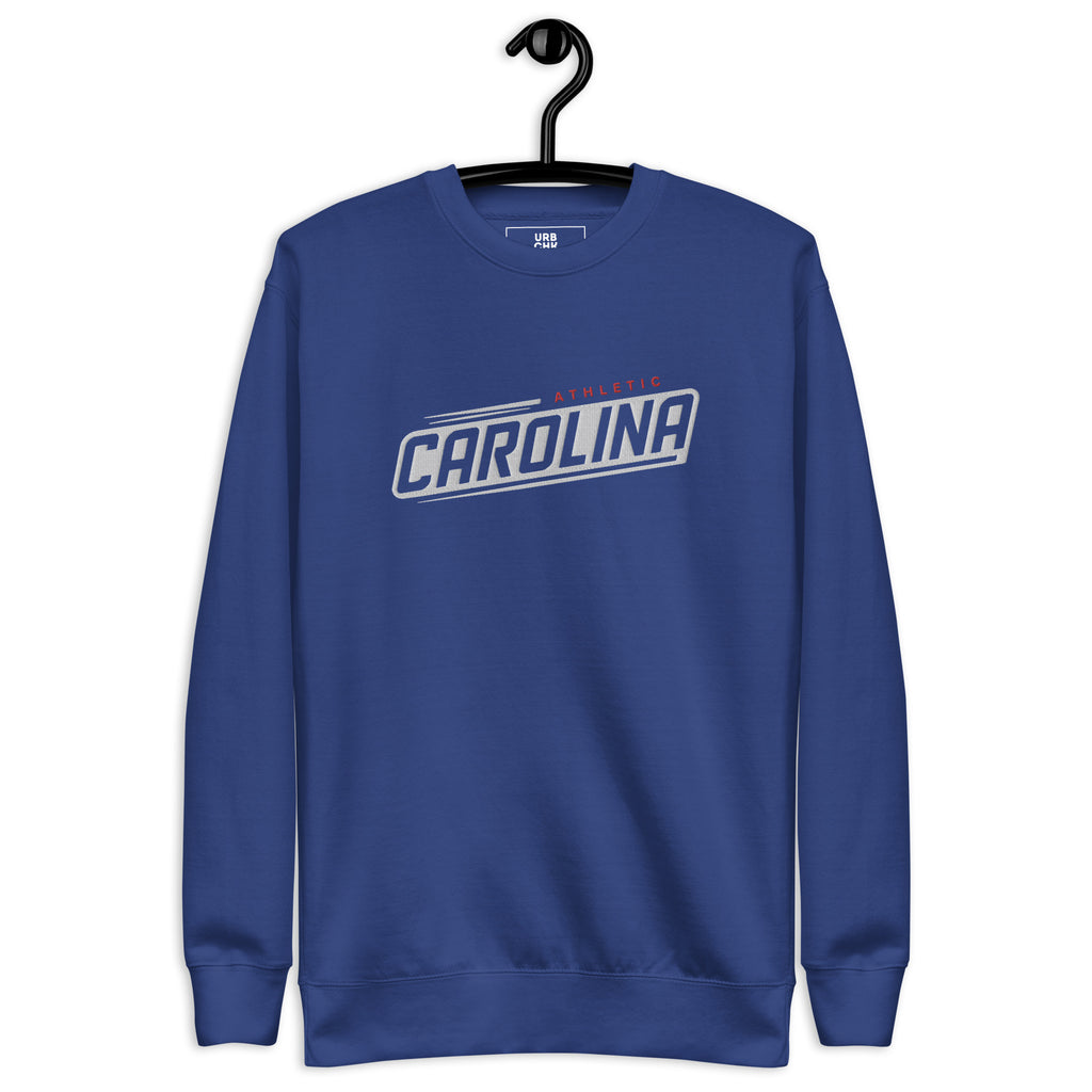 A blue crew neck pullover sweatshirt with 'Carolina' text embroidered on the front.