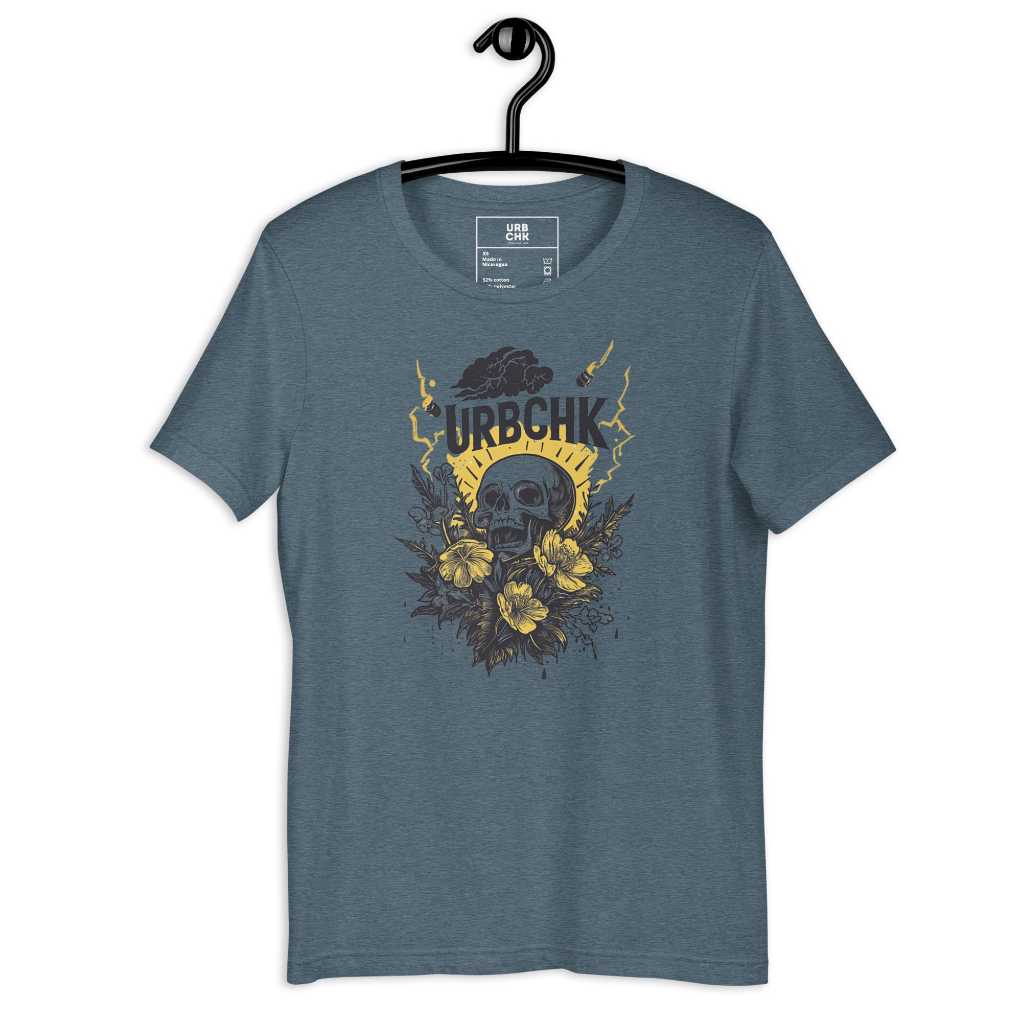 Blue t-shirt with skull and floral design on a hanger against a white background